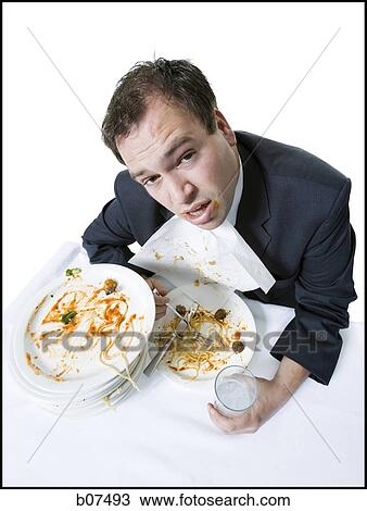 Overweight businessman gorging himself on spaghetti View Large Photo Image Stock Image - Overweight businessman gorging himself on spaghetti. Fotosearch