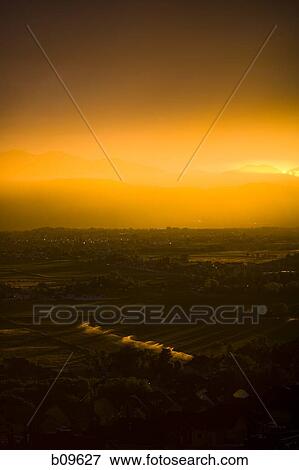 Panoramic view of a landscape at dusk View Large Photo Image Stock Photo - Panoramic view of a landscape at dusk. Fotosearch