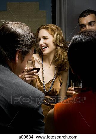 Partygoers socializing View Large Photo Image Picture - Partygoers socializing. Fotosearch
