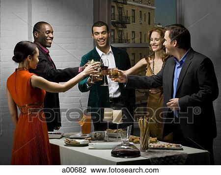 Partygoers toasting View Large Photo Image Stock Image - Partygoers toasting. Fotosearch