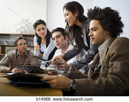 Stock Photo - People in business meeting in board room. Fotosearch