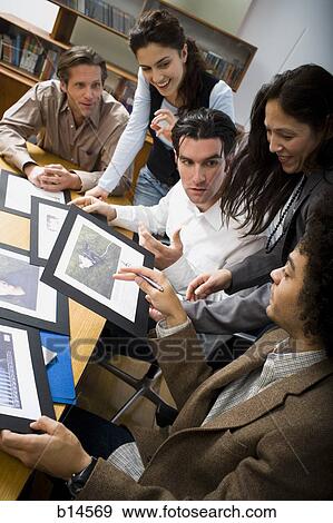 Stock Photo - People in business meeting in board room. Fotosearch