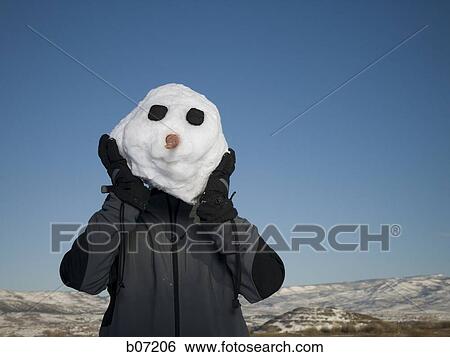 Stock Photograph - Person posing as snowman. Fotosearch