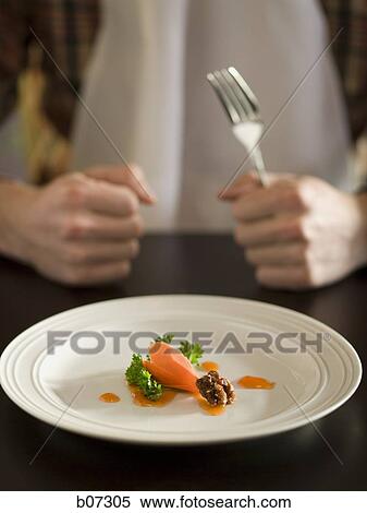 Person with small amount of food View Large Photo Image Stock Photography - Person with small amount of food. Fotosearch