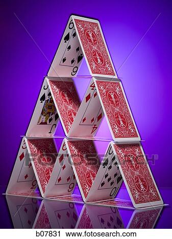 Stock Image - Playing cards stacked in a pyramid shape. Fotosearch