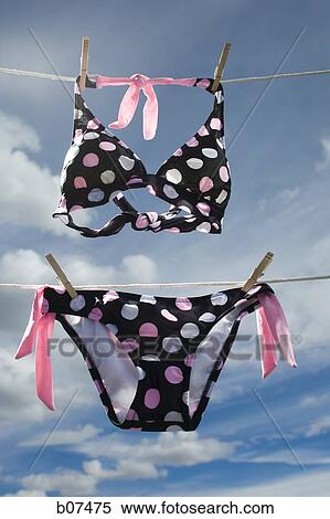 Polka dot bikini hanging on a clothesline View Large Photo Image Stock Photography - Polka dot bikini hanging on a clothesline. Fotosearch