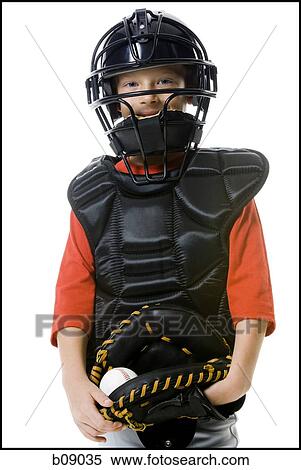 Stock Photography - Portrait of a baseball catcher holding a catcher's mitt. Fotosearch