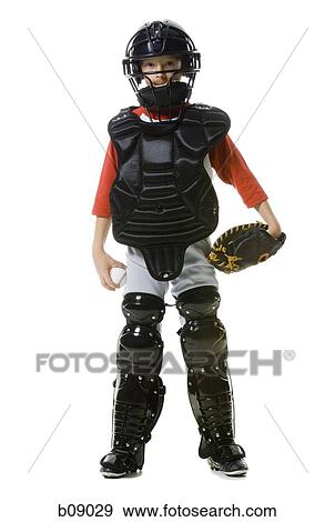 Portrait of a baseball catcher standing View Large Photo Image Stock Photo - Portrait of a baseball catcher standing. Fotosearch