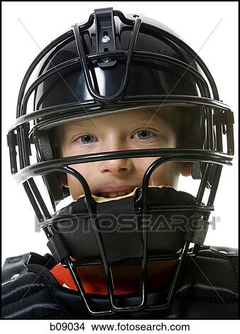 Picture - Portrait of a baseball catcher wearing a baseball helmet. Fotosearch