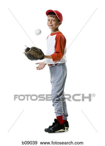 Portrait of a baseball player tossing a baseball View Large Photo Image Stock Photo - Portrait of a baseball player tossing a baseball. Fotosearch
