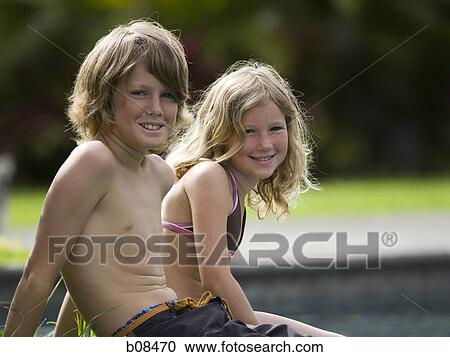 Portrait of a boy and his sister smiling View Large Photo Image Stock Image - Portrait of a boy and his sister smiling. Fotosearch