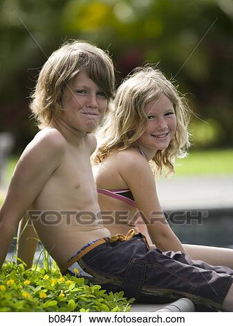 Portrait of a boy and his sister smiling View Large Photo Image Stock Image - Portrait of a boy and his sister smiling. Fotosearch