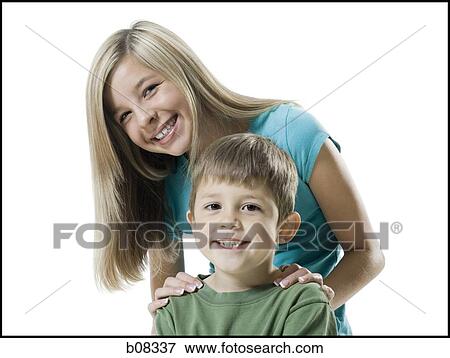 Portrait of a boy and his sister smiling View Large Photo Image Stock Photo - Portrait of a boy and his sister smiling. Fotosearch