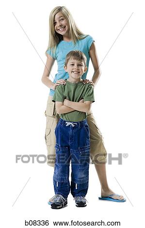 Portrait of a boy and his sister smiling View Large Photo Image Stock Photograph - Portrait of a boy and his sister smiling. Fotosearch