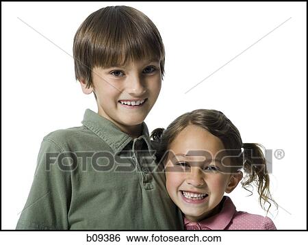 Portrait of a boy and his sister smiling View Large Photo Image Stock Photograph - Portrait of a boy and his sister smiling. Fotosearch