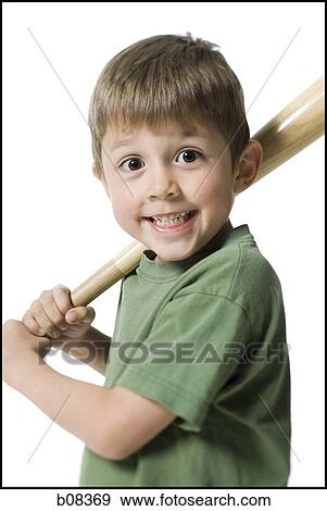 Portrait of a boy holding a baseball bat View Large Photo Image Stock Photo - Portrait of a boy holding a baseball bat. Fotosearch