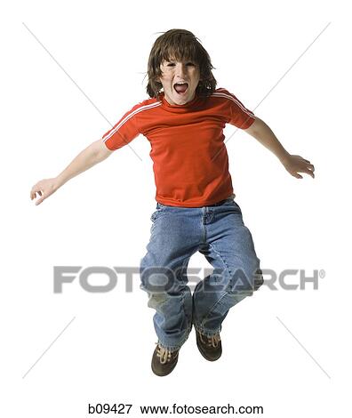 Stock Photo - Portrait of a boy jumping in mid air. Fotosearch