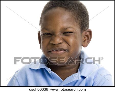 Portrait of a boy making a face View Large Photo Image Stock Photograph - Portrait of a boy making a face. Fotosearch