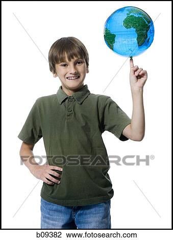 Portrait of a boy touching a globe View Large Photo Image Stock Image - Portrait of a boy touching a globe. Fotosearch