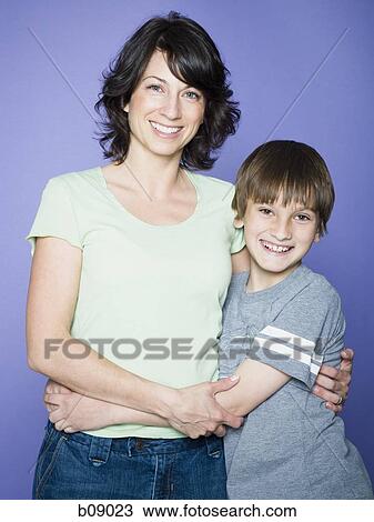 Portrait of a boy with his arm around his mother View Large Photo Image Stock Image - Portrait of a boy with his arm around his mother. Fotosearch