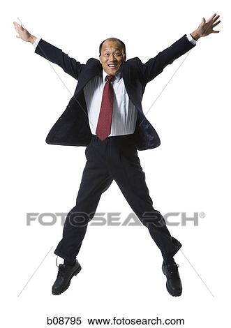 Portrait of a businessman jumping with his arms outstretched View Large Photo Image Stock Photography - Portrait of a businessman jumping with his arms outstretched. Fotosearch