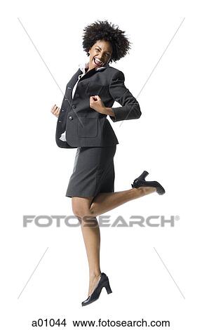 Portrait of a businesswoman jumping View Large Photo Image Picture - Portrait of a businesswoman jumping. Fotosearch
