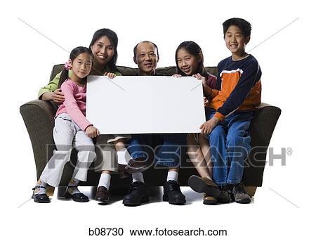 Portrait of a family holding a blank sign and smiling View Large Photo Image Stock Image - Portrait of a family holding a blank sign and smiling. Fotosearch