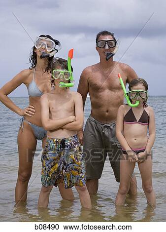 Stock Image - Portrait of a family wearing scuba masks and snorkels. Fotosearch