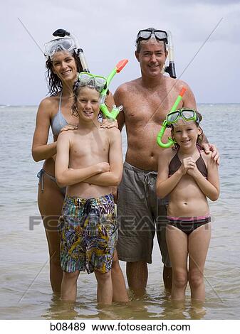 Portrait of a family wearing scuba masks and snorkels View Large Photo Image Stock Photo - Portrait of a family wearing scuba masks and snorkels. Fotosearch
