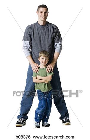 Portrait of a father and his son smiling View Large Photo Image Stock Photograph - Portrait of a father and his son smiling. Fotosearch