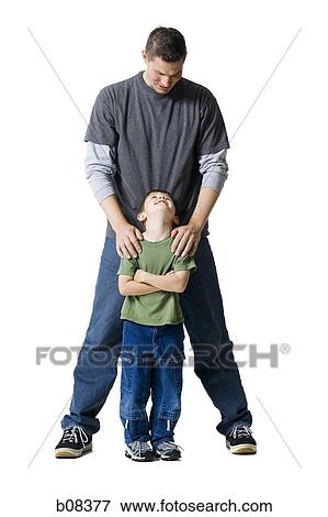 Portrait of a father and his son looking at each other View Large Photo Image Stock Photo - Portrait of a father and his son looking at each other. Fotosearch
