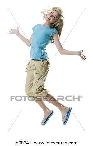 Portrait of a girl jumping and smiling View Large Photo Image Stock Image - Portrait of a girl jumping and smiling. Fotosearch