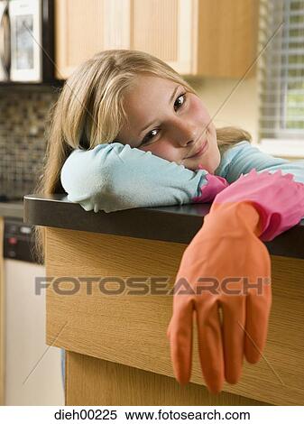 Stock Photography - Portrait of a girl leaning on the table. Fotosearch
