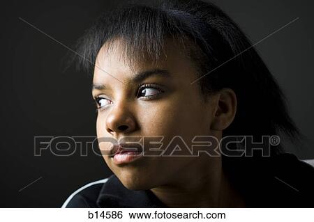 Portrait of a girl looking away View Large Photo Image Stock Photograph - Portrait of a girl looking away. Fotosearch