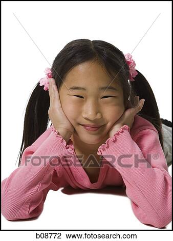 Portrait of a girl lying on the floor and smiling View Large Photo Image Stock Image - Portrait of a girl lying on the floor and smiling. Fotosearch