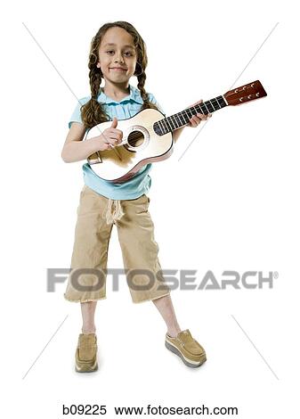 Stock Photography - Portrait of a girl playing the guitar. Fotosearch