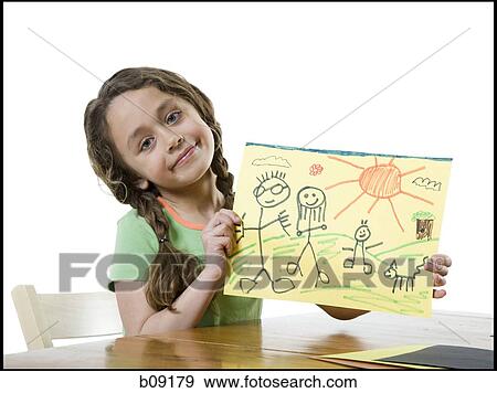 Portrait of a girl showing a drawing View Large Photo Image Stock Photo - Portrait of a girl showing a drawing. Fotosearch
