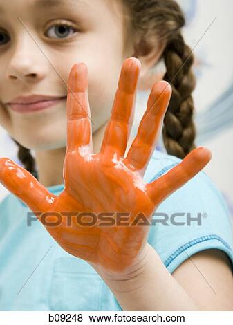 Portrait of a girl showing her painted hand View Large Photo Image Stock Photo - Portrait of a girl showing her painted hand. Fotosearch