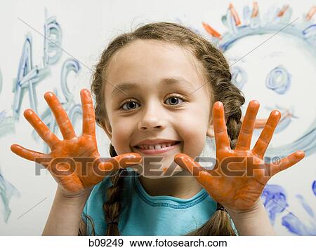 Portrait of a girl showing her painted hands View Large Photo Image Stock Photo - Portrait of a girl showing her painted hands. Fotosearch