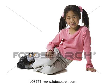 Portrait of a girl sitting on the floor and smiling View Large Photo Image Stock Image - Portrait of a girl sitting on the floor and smiling. Fotosearch