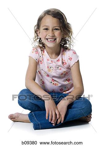 Portrait of a girl sitting with her legs crossed View Large Photo Image Stock Image - Portrait of a girl sitting with her legs crossed. Fotosearch