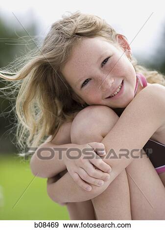 Stock Photo - Portrait of a girl smiling. Fotosearch