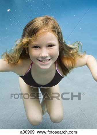 Stock Photo - Portrait of a girl swimming. Fotosearch