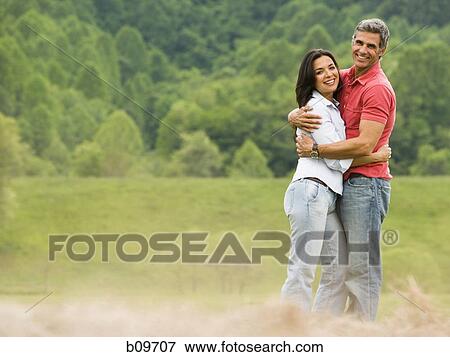 Portrait of a man and a woman embracing each other View Large Photo Image Stock Photo - Portrait of a man and a woman embracing each other. Fotosearch
