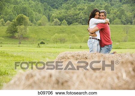 Portrait of a man and a woman embracing each other View Large Photo Image Stock Photograph - Portrait of a man and a woman embracing each other. Fotosearch