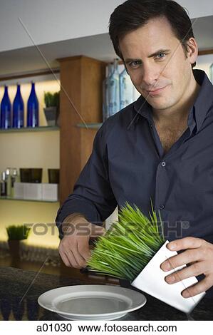Portrait of a man cutting wheatgrass View Large Photo Image Stock Image - Portrait of a man cutting wheatgrass. Fotosearch