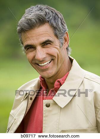 Portrait of a man smiling View Large Photo Image Stock Photo - Portrait of a man smiling. Fotosearch