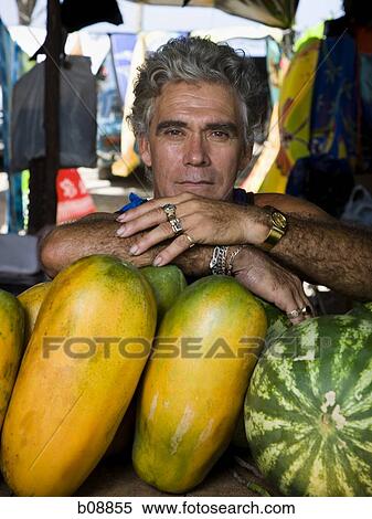 Stock Photography - Portrait of a man with fruit. Fotosearch