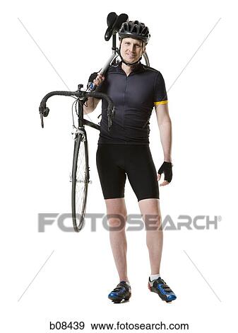 Portrait of a mature man carrying a cycle on his shoulder View Large Photo Image Stock Photo - Portrait of a mature man carrying a cycle on his shoulder. Fotosearch