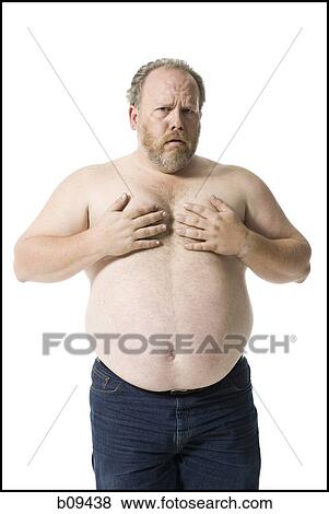 Portrait of a mature man covering his chest with his hands View Large Photo Image Stock Photo - Portrait of a mature man covering his chest with his hands. Fotosearch